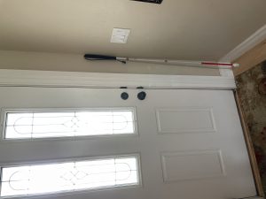 Nicole's White Cane Standing Next to Her Front Door